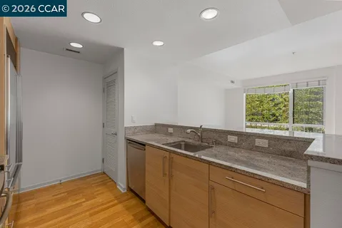 a kitchen with a sink and a window