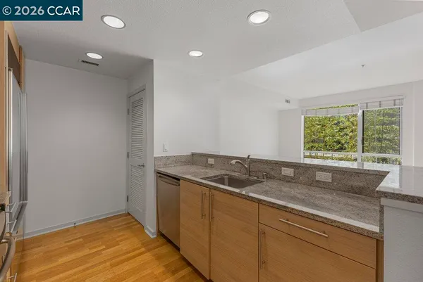 a kitchen with a sink and a window