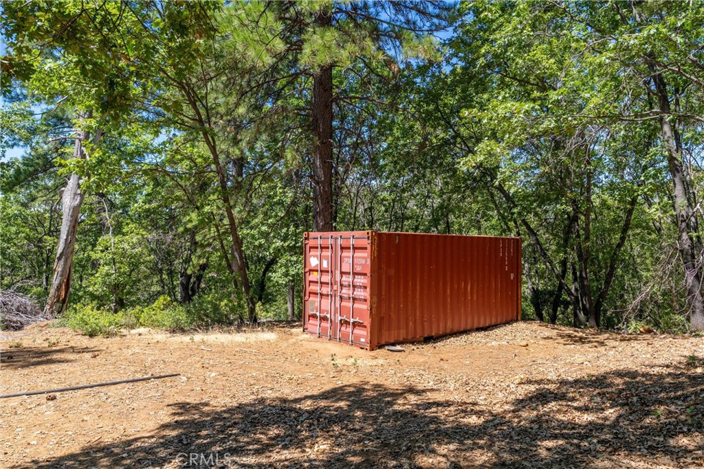 0 Knolls Drive Forest Ranch, CA 95942 - Photo 27 of 68 a backyard of a house with a bench and trees