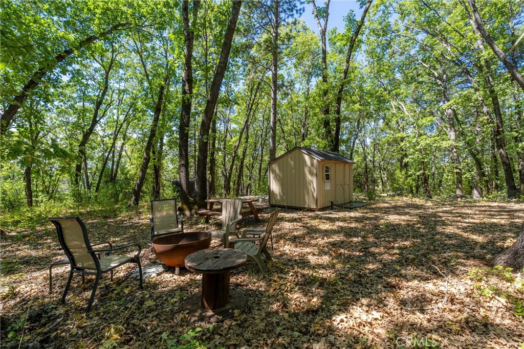 0 Knolls Drive Forest Ranch, CA 95942 - Photo 3 of 68 a backyard of a house with table and chairs