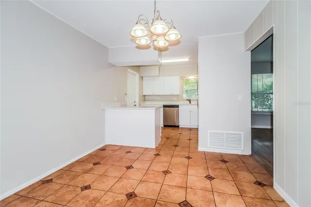 a very nice looking dining room with a large window