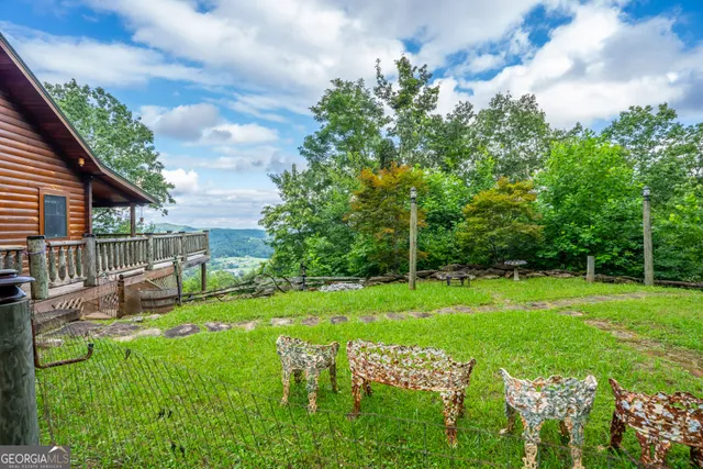 a balcony with wooden floor and fence