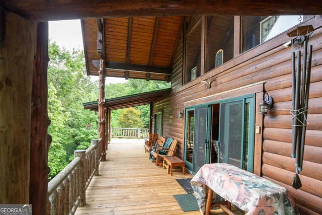 a view of a dining room with furniture wooden floor and chandelier