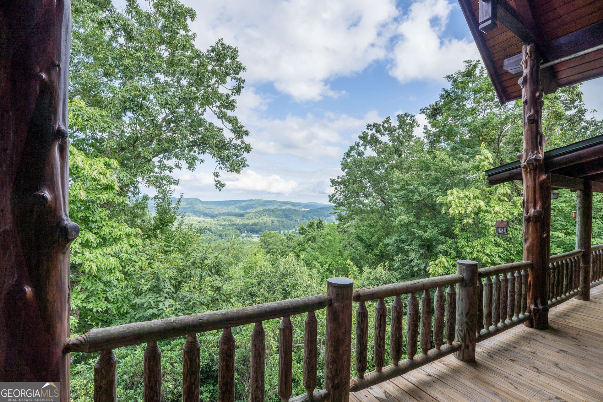 38 Old Blue Trail Tiger, GA 30576 - Photo 19 of 72 a balcony with wooden floor and fence