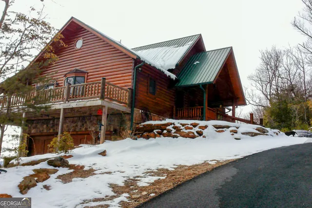 a large kitchen with a table and chairs
