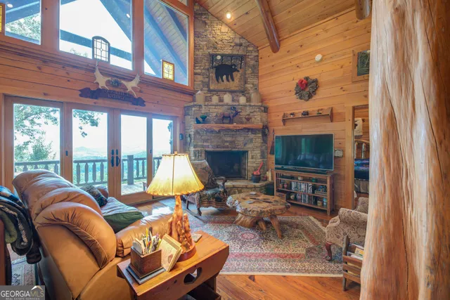 a view of a living room with furniture and a flat screen tv