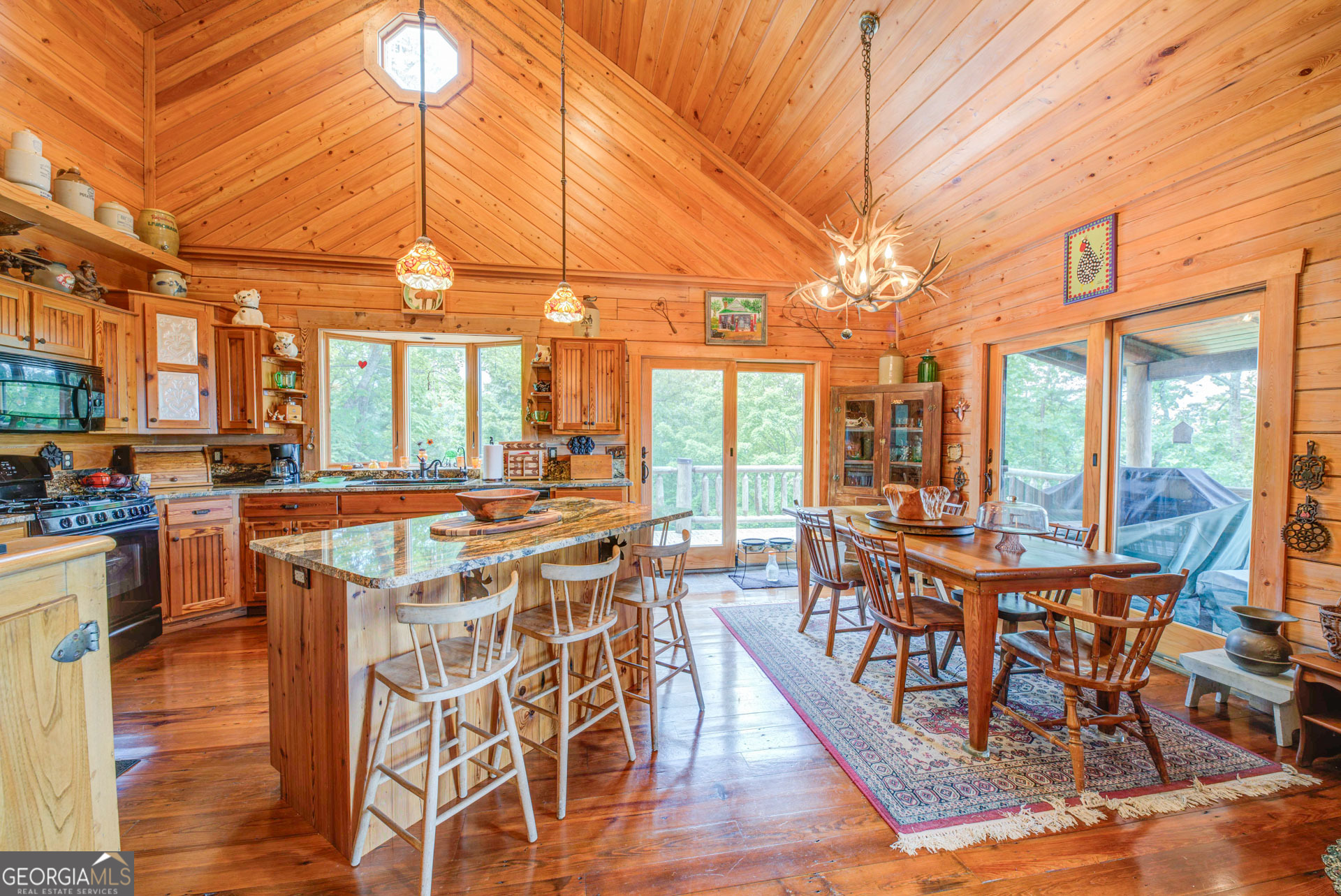 38 Old Blue Trail Tiger, GA 30576 - Photo 24 of 72 a view of a dining room with furniture wooden floor and chandelier