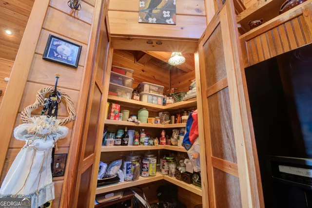a view of a balcony with a sink and wooden floor