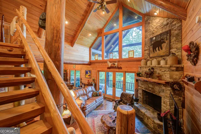 an aerial view of a house with a yard