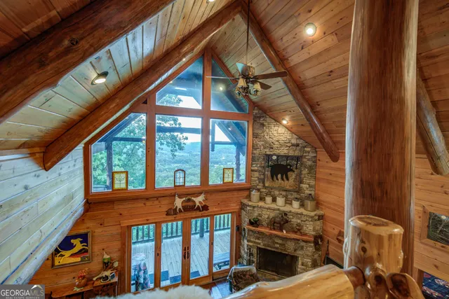 a bedroom with a bed a dresser with wooden floor