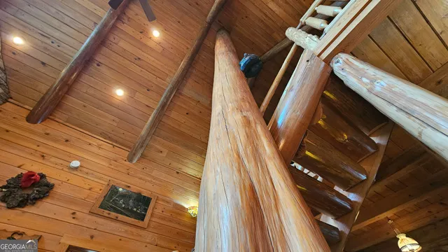 a view of living room filled with furniture and window