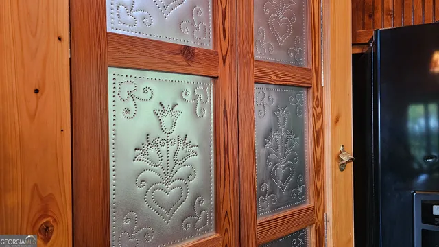 a living room with furniture a piano and a flat screen tv