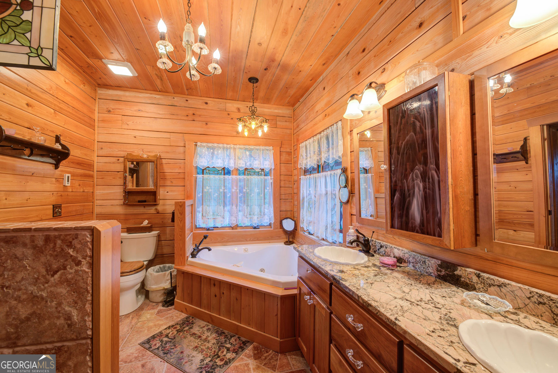 38 Old Blue Trail Tiger, GA 30576 - Photo 51 of 72 a bathroom with a granite countertop sink and a mirror