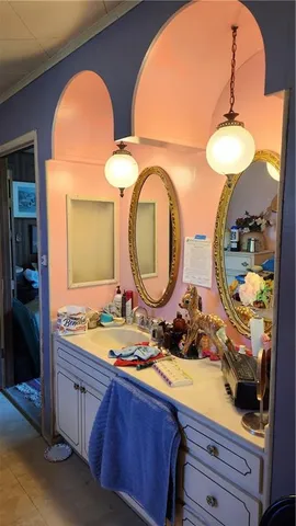 a bathroom with a double vanity sink and a mirror
