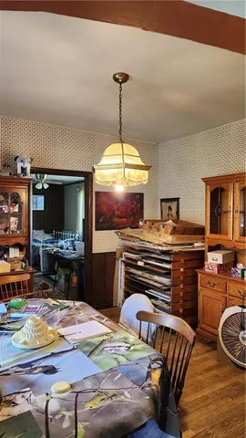 a bedroom with furniture and a flat screen tv