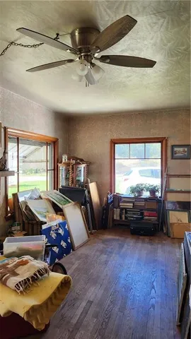 a bedroom with furniture and a window