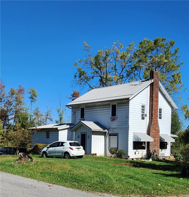 476 Hartwick Road Mercer, PA 16137 - Photo 2 of 22 a front view of a house with a yard