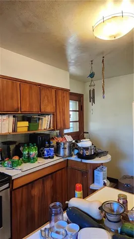 a kitchen with stainless steel appliances granite countertop a sink and cabinets