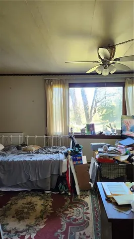 a living room with table or chairs and a swimming pool