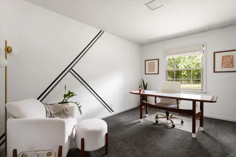 a view of a dining room with furniture window and outside view