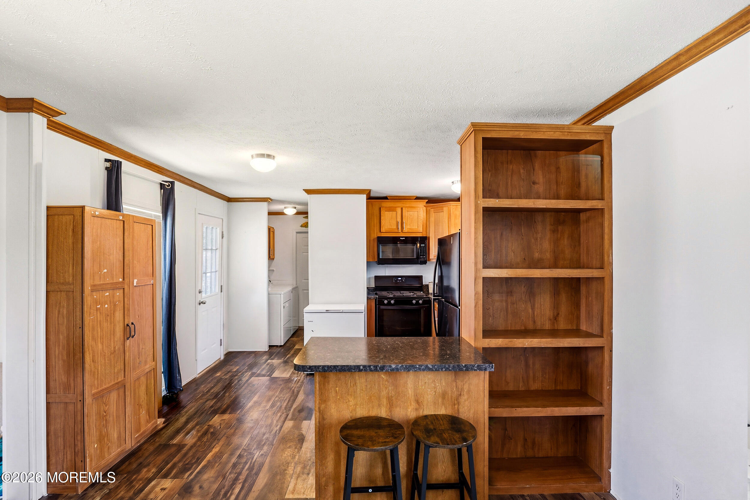 40 Locust Grove Hazlet, NJ 07730 - Photo 8 of 15 a living room with wooden floor and a cabinet