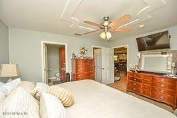 126 Norton's Fish Camp Road Satsuma, FL 32189 - Photo 14 of 25 a bedroom with a bed and a flat screen tv