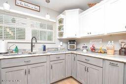 126 Norton's Fish Camp Road Satsuma, FL 32189 - Photo 23 of 25 a kitchen with a sink cabinets and window
