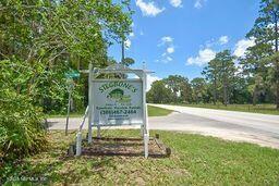 126 Norton's Fish Camp Road Satsuma, FL 32189 - Photo 25 of 25 a sign of golf club on a wall under a tree