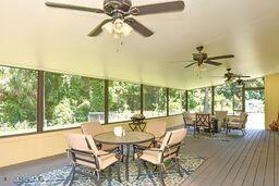 126 Norton's Fish Camp Road Satsuma, FL 32189 - Photo 3 of 25 a dining room with furniture garden view and a chandelier