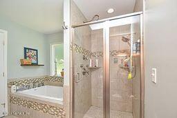 126 Norton's Fish Camp Road Satsuma, FL 32189 - Photo 4 of 25 a bathroom with a shower and a bath tub