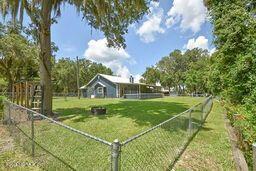 126 Norton's Fish Camp Road Satsuma, FL 32189 - Photo 8 of 25 a view of a house with a big yard and large trees