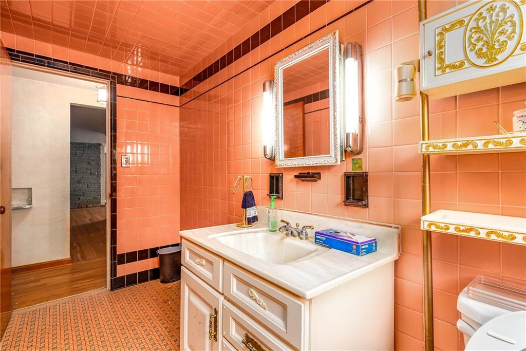 3166 Harts Run Road Glenshaw, PA 15116 - Photo 15 of 30 a bathroom with a sink and a mirror