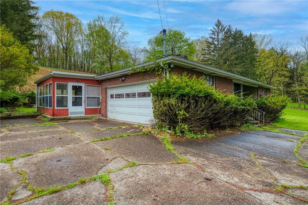 3166 Harts Run Road Glenshaw, PA 15116 - Photo 28 of 30 a view of a house with a yard plants and large tree