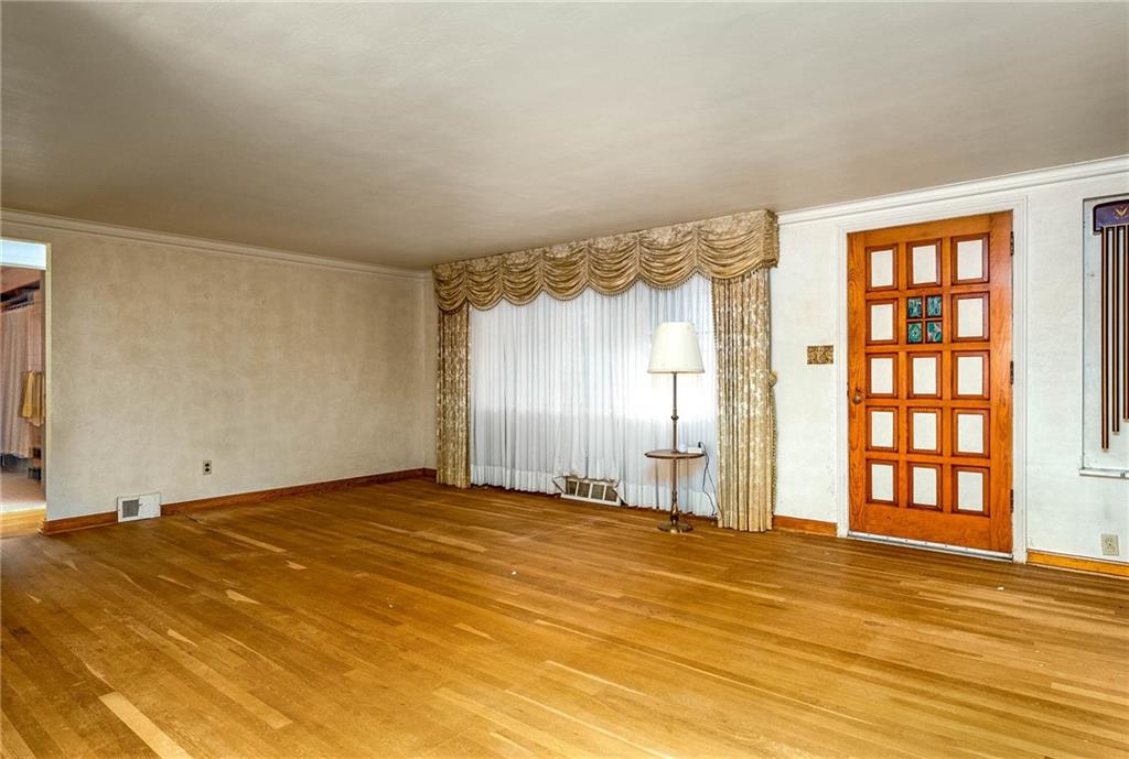 3166 Harts Run Road Glenshaw, PA 15116 - Photo 4 of 30 a view of an empty room with wooden floor and a window
