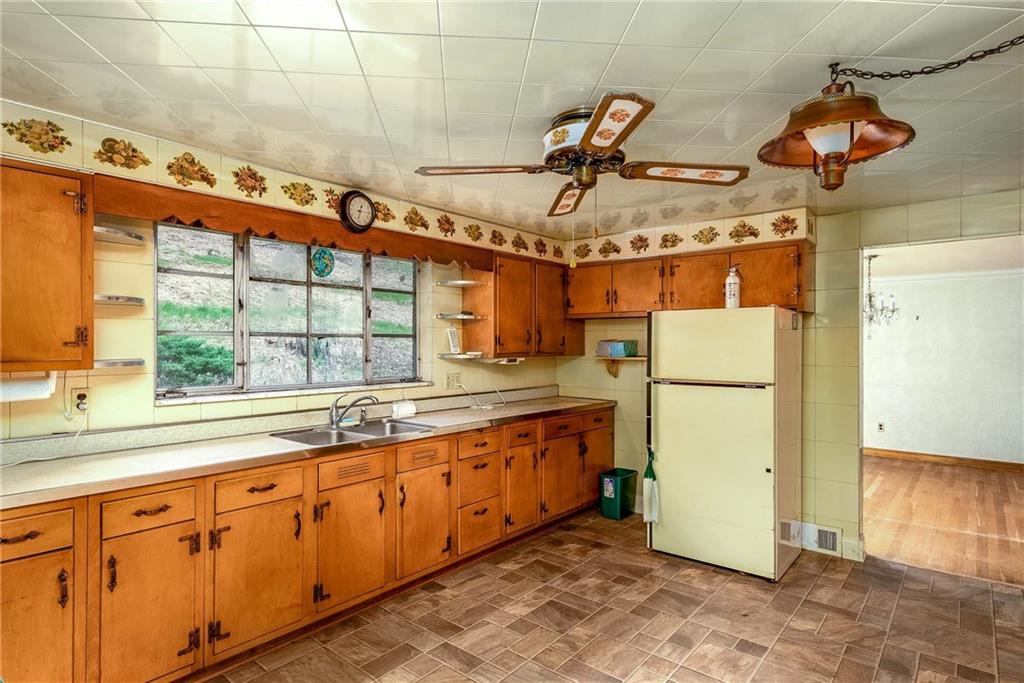 3166 Harts Run Road Glenshaw, PA 15116 - Photo 5 of 30 a kitchen with refrigerator and window