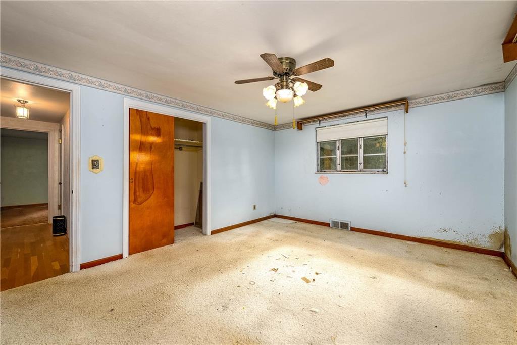 3166 Harts Run Road Glenshaw, PA 15116 - Photo 10 of 30 an empty room with a empty space and windows