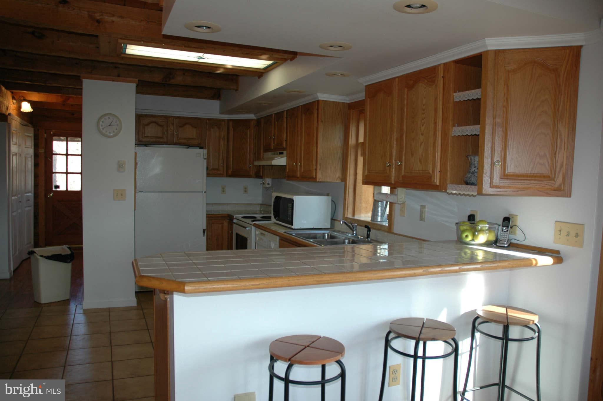 20111 Gunpowder Road Manchester, MD 21102 - Photo 14 of 30 a kitchen with stainless steel appliances granite countertop a sink refrigerator and cabinets