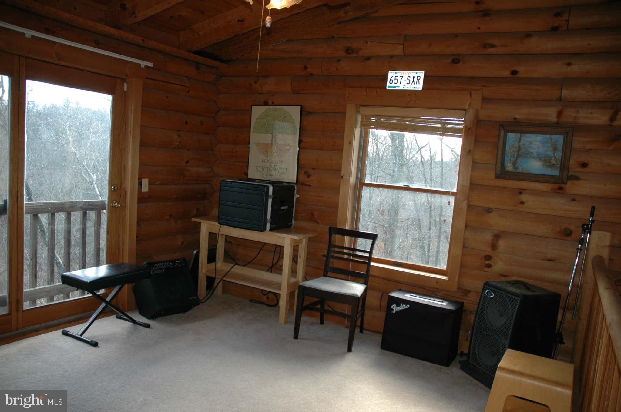 20111 Gunpowder Road Manchester, MD 21102 - Photo 20 of 30 a living room with furniture a flat screen tv and a window