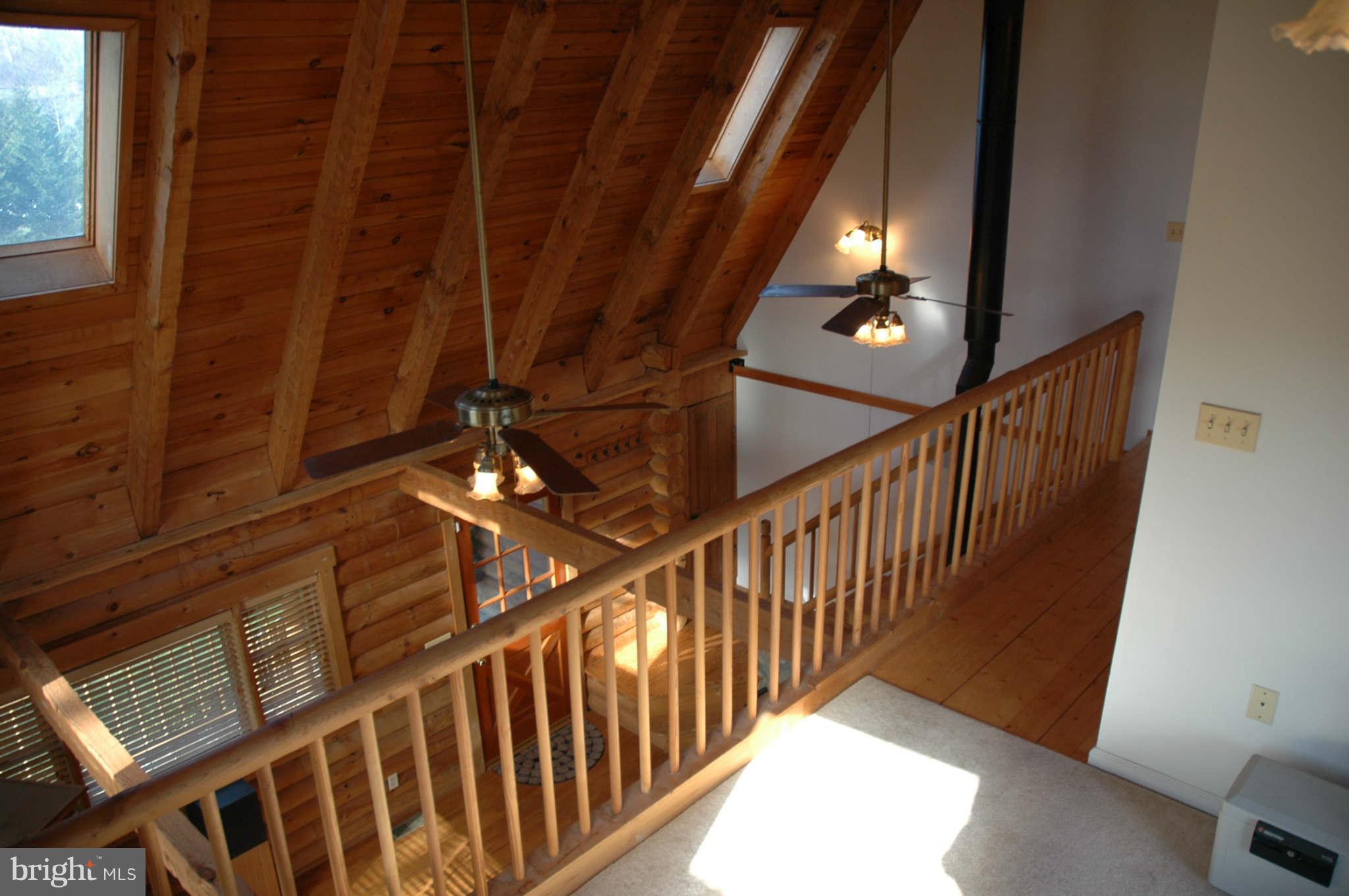 20111 Gunpowder Road Manchester, MD 21102 - Photo 22 of 30 a view of staircase with railing and a chandelier