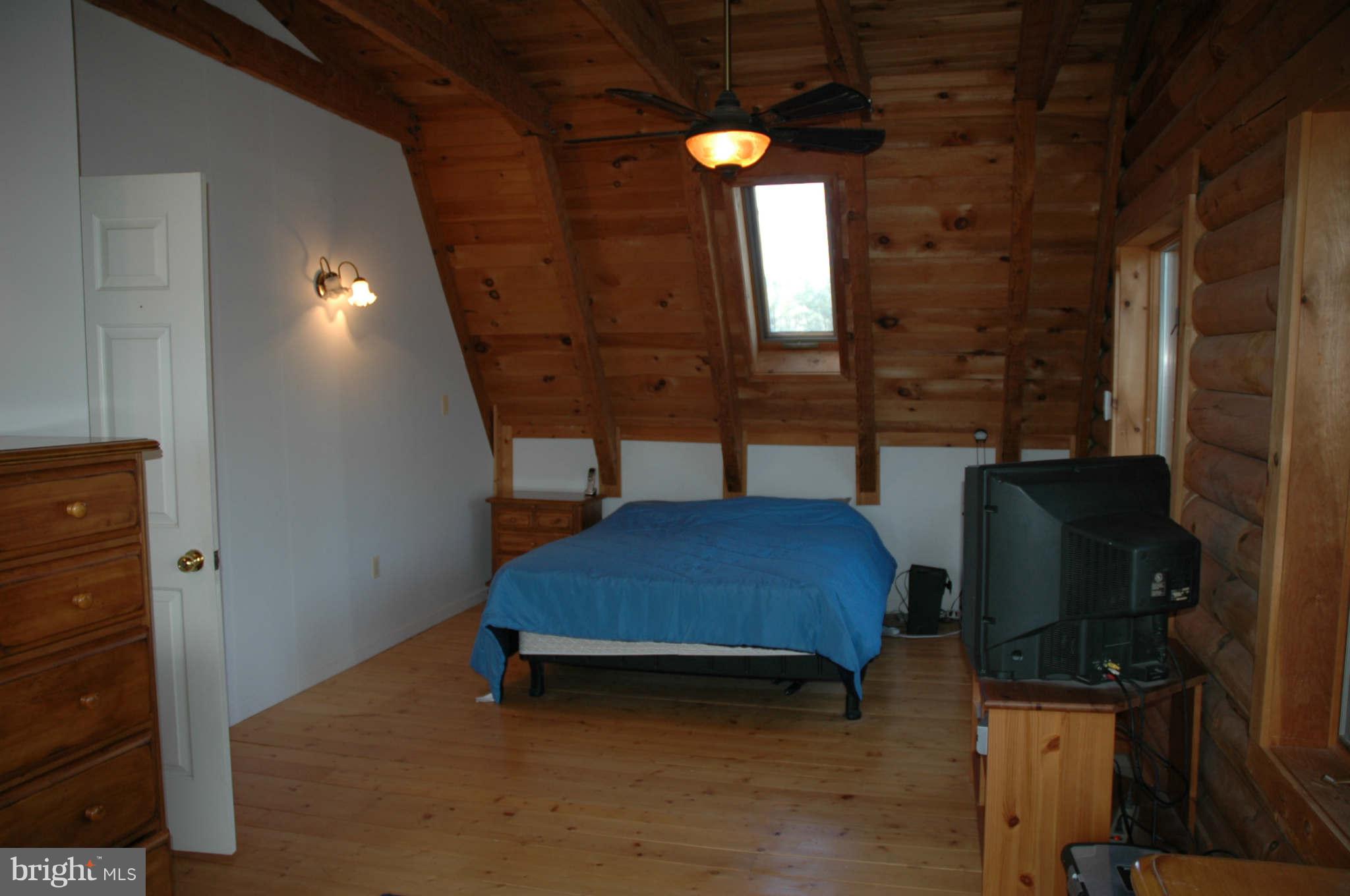 20111 Gunpowder Road Manchester, MD 21102 - Photo 23 of 30 a bedroom with a bed and a mirror