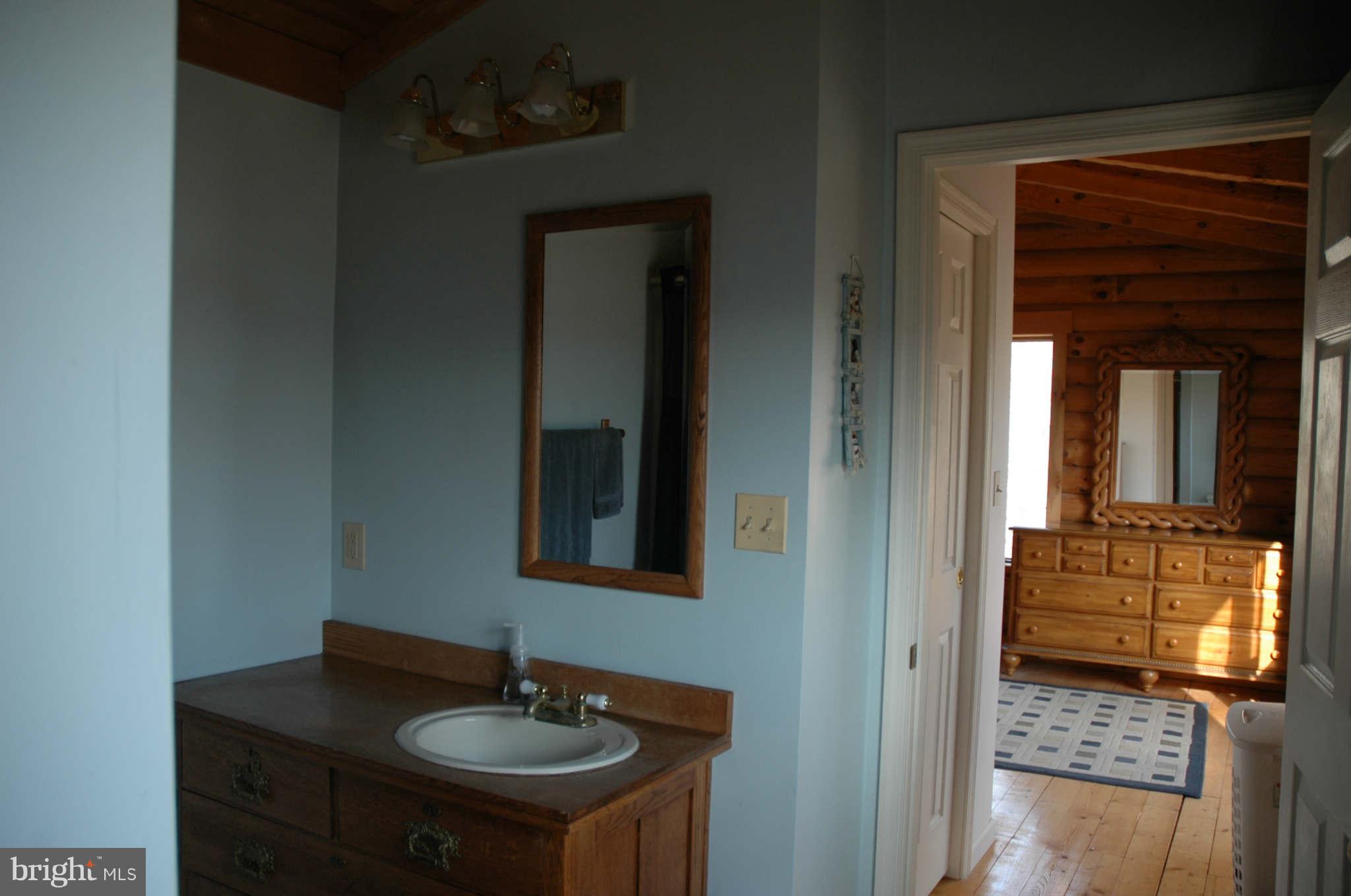 20111 Gunpowder Road Manchester, MD 21102 - Photo 24 of 30 a bathroom with a sink and a mirror