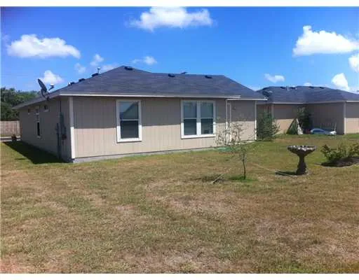 a house view with a garden space