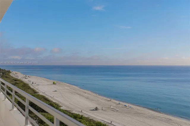 a view of an empty space and wooden floor
