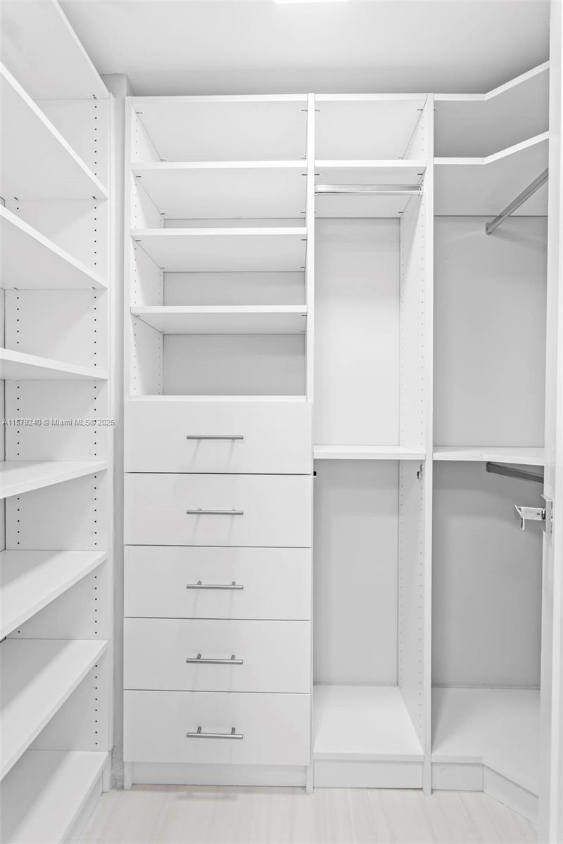 5555 Collins Avenue, Unit 14N Miami Beach, FL 33140 - Photo 12 of 16 a view of walk in closet