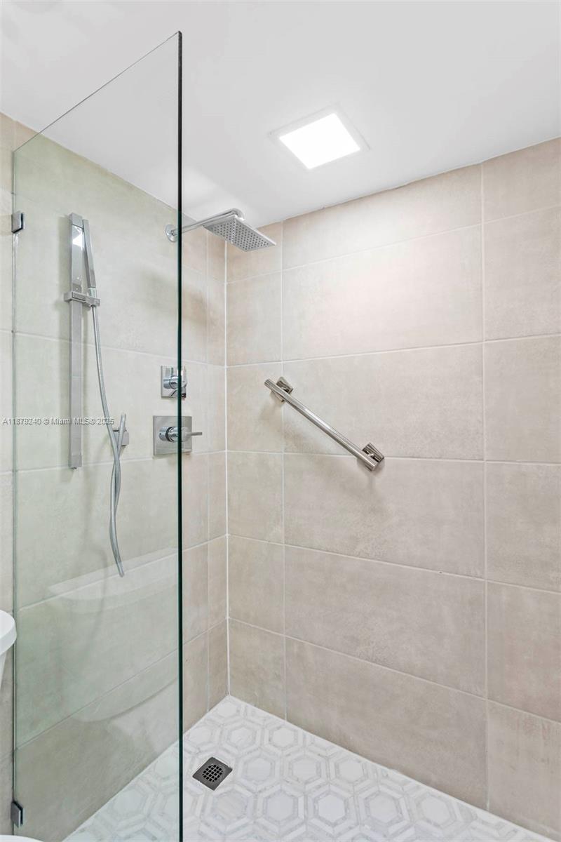 5555 Collins Avenue, Unit 14N Miami Beach, FL 33140 - Photo 8 of 16 a bathroom with a shower