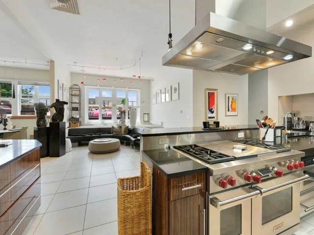 a kitchen with stove and cabinets