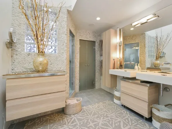 a bathroom with a sink a toilet and a mirror