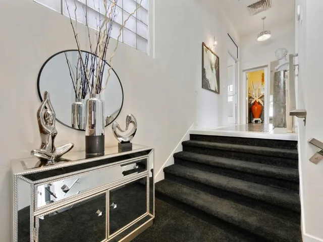 a view of entryway with wooden floor