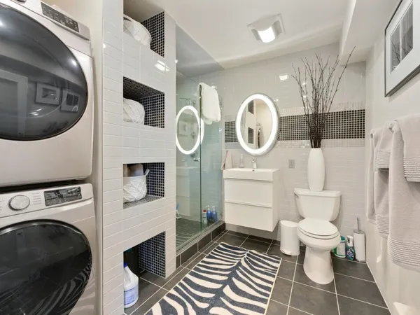 a bedroom with bed and wall painting