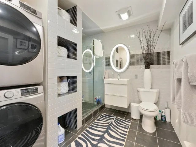 a bedroom with bed and wall painting